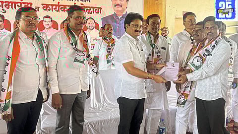 Nitin Patil addresses the NCP workers' meet in Koregaon, encouraging party members to take a political role and prepare for future challenges in Maharashtra politics.