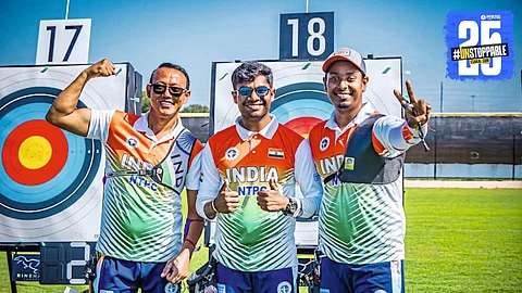 Dhiraj Bommadevara celebrates his bronze medal win as the Indian men's team secures silver at the World Archery Championship.