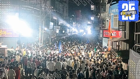 Ambedkar followers pay floral tribute at statues during a peaceful procession under heavy police security.