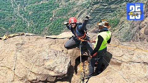 Shahunagar youth celebrates after successfully completing the 1800-feet Konkankada climb and rappel adventure.