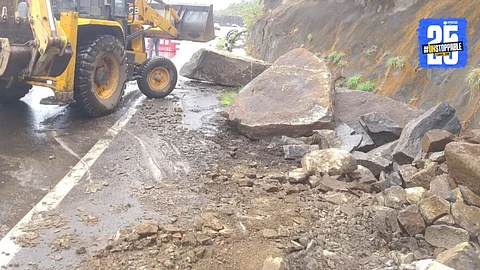 Debris from a landslide blocks the Pune-Khed Shivapur highway near New Katraj Tunnel amid heavy rainfall, disrupting traffic as monsoon intensifies
