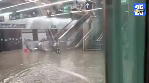 Rainwater leaks from the ceiling and flows down the stairs at a Mumbai metro station, turning the platform area into a virtual pond.