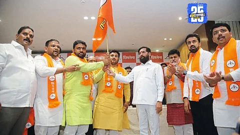 Santosh Vetal with supporters during his formal entry into Shiv Sena; Deputy CM Eknath Shinde present