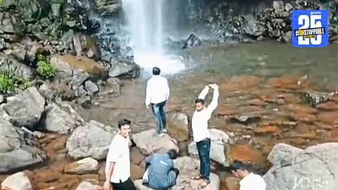 Tourists seen dangerously close to Vajrai Falls in Bhambavali, ignoring clear danger signs and risking lives."