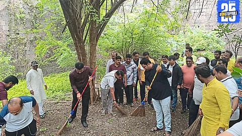 Cleanliness drive in garden while garbage piles lie unattended near Mandai and bus stand — a shocking contrast!