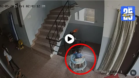 A toddler in a walker dangerously approaches the stairs as no adult notices — a terrifying moment caught on CCTV that has gone viral