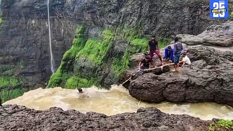 Rescue team retrieving the injured tourist from a deep valley near Kalu Waterfall following a monsoon accident.