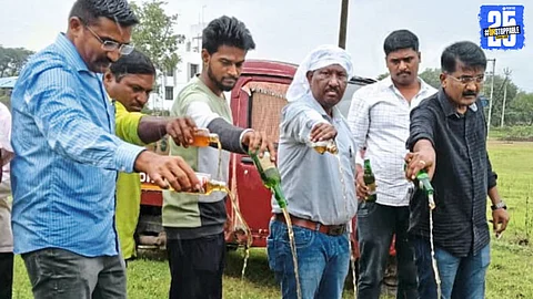 Pangari village: State Excise officials destroying seized liquor worth ₹1.25 lakh during an anti-liquor drive.