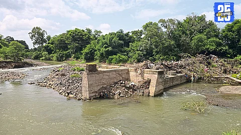Damaged barrage near Pusegaon causes waterlogging and blocks roads to farmlands, leaving farmers stranded.