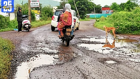 Pothole-filled roads, stray dogs, and monkeys turn Dhebewadi commute into a risky obstacle course.