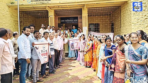 Jain community members in Mhaswad holding placards and banners in support of Mahadevi the elephant, demanding immediate rescue.