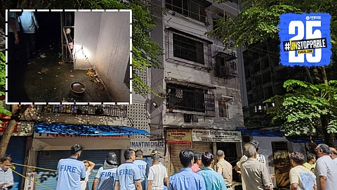 Rescue workers and local authorities at the site where a four-storey building collapsed in Dombivli West, leaving 25 families homeless.
