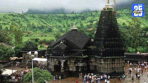"Security personnel controlling chaos as devotees clash at Trimbakeshwar Temple during Shravan month rush."