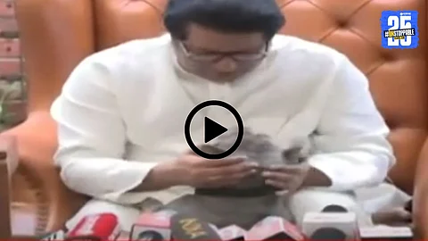 Raj Thackeray cuddles his pet dog Rhino during a press conference, creating a lighthearted viral moment.