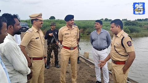 “SP Atul Kulkarni reviewing arrangements at Lamboti Ganesh immersion site; officers instructed on safety.”
