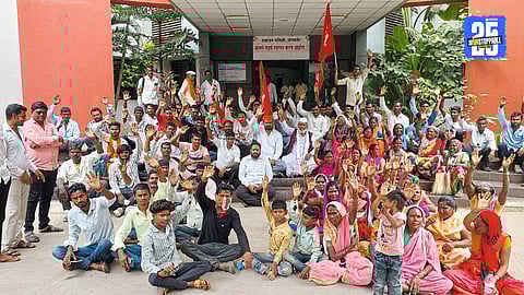 Tribals and villagers in Sangamner march demanding housing schemes, water supply, and Gramsevak transfer.