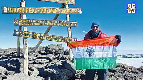 Abhijit Bhoite from Wai proudly holds the flag at Kilimanjaro summit after a determined climb.
