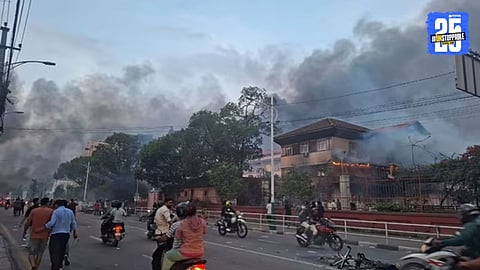 Protesters in Nepal torch vehicles and government buildings amid escalating violence following PM Oli’s resignation."