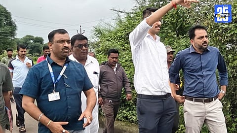 “Collector Kumar Ashirwad inspecting submerged barrages in Mohol taluka after heavy rains.”