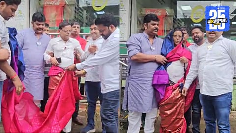BJP leaders drape saree to congress worker