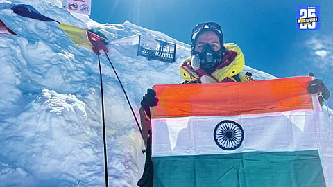 Priyanka Mohite proudly raises the Indian tricolor atop Mount Manaslu after 16 hours of strenuous climbing.