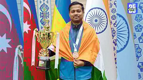 Indian chess player Devendra Vaidya proudly displays his bronze medal at the Asian Deaf Championship in Uzbekistan.
