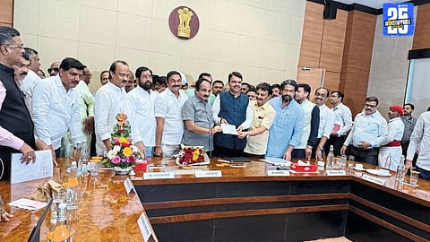 Makarand Patil and Nitin Patil of Satara District Bank hand over ₹1.25 crore flood relief cheque to CM Devendra Fadnavis in Mumbai.