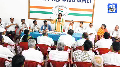 “Congress National Secretary B.M. Sandeep addressing party workers at Satara Congress Bhavan; sharp criticism directed at RSS.”