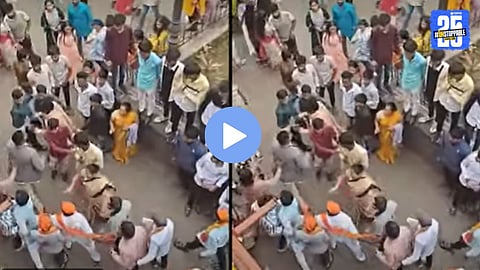 Police intervening to control a clash between two groups during the Diwali Padwa morning event at Sarasbaug, Pune.