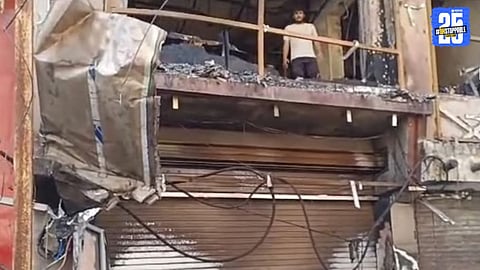 Fire brigade in action at Akola’s old cloth market after a massive blaze gutted a showroom, causing heavy losses.