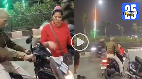 A screenshot from Patna Marine Drive showing the moment when a pregnant woman and a traffic police officer engaged in a heated argument, leading to a viral video online.