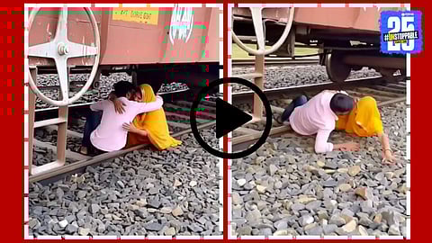 “A couple sitting dangerously close to the railway tracks moments before the train begins moving, captured in a viral video.”