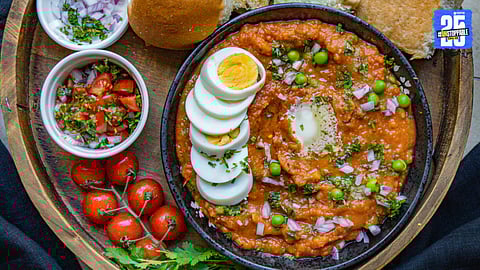 Spicy anda pav bhaji masala gravy loaded with mashed boiled eggs, topped with fresh coriander and served with butter-toasted pav – a perfect Maharashtrian street-style breakfast or dinner!