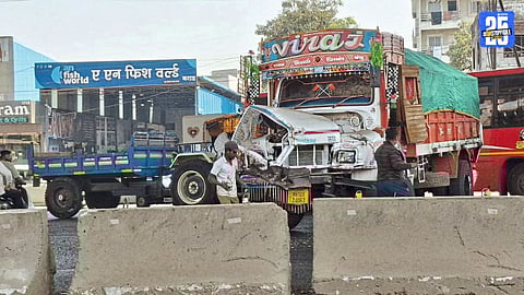 Severely damaged truck after a container collision near Karad on the Pune–Bengaluru highway; driver escaped narrowly.