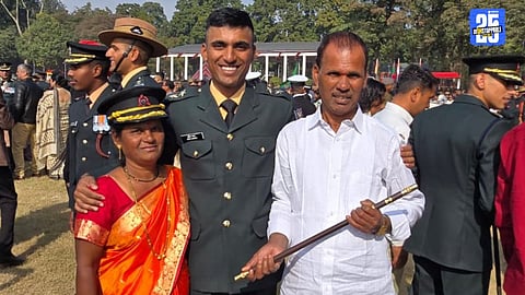 Newly commissioned Lieutenant with family members celebrating his achievement.