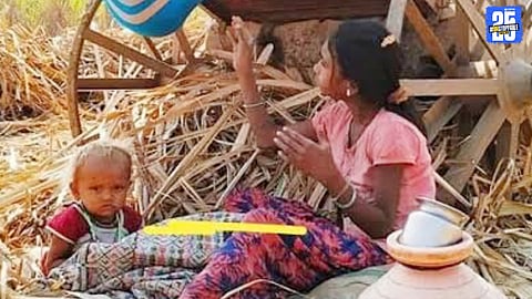 Sugarcane cutting labourers and their children braving cold nights at a temporary settlement.