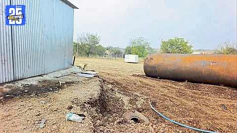 Police inspect sealed tanks of illegal biodiesel seized from a shed
