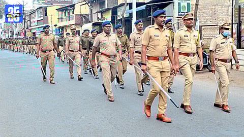 Police personnel conducting a route march in Ichalkaranji ahead of municipal elections.