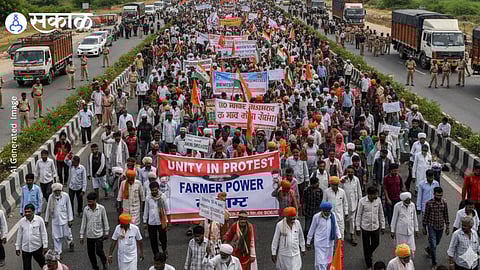Farmers and trade union members participate in Bharat Bandh protest rally demanding withdrawal of new labour laws in India.