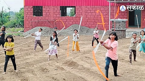 Raju Anavate practicing traditional Shivkalin weapons after morning Shiv pujan.