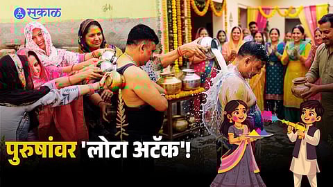 Women participating in the traditional ‘Lota Maar’ Holi celebration in the village.