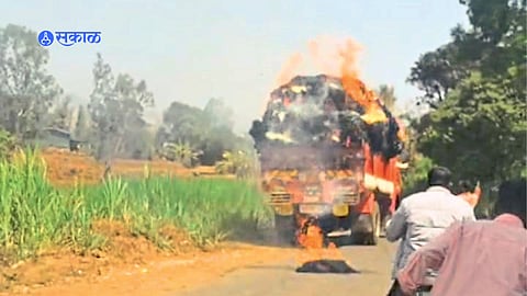A hay-loaded truck burns