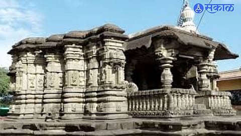 The 1886 stone inscription discovered near Maneshwar Temple in Sakhar, documenting historic lake restoration work.