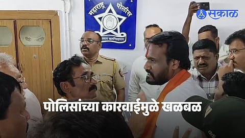 Akola Shiv Sena leader Sagar Bharuka being taken into police custody following a heated clash with BJP leader Vijay Agrawal inside the municipal corporation premises.