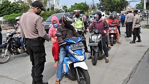 Coronavirus Toilet duty for Jakarta's social distancing violators