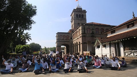 Officers and employees of Pune University stop writing at the university