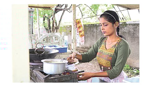Interior designer young woman and tea pot ...