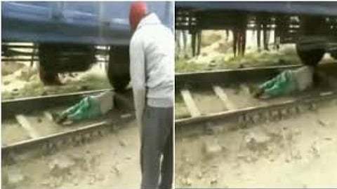 Thriling video Women sleeping on rails to rescue herself from moving train