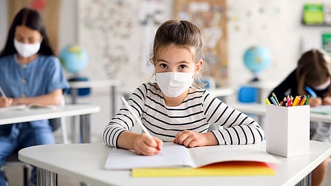 student with mask in school