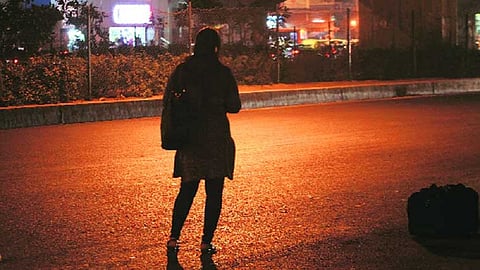 woman standing on road.jpg